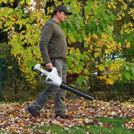 Mann using cordless leaf blower